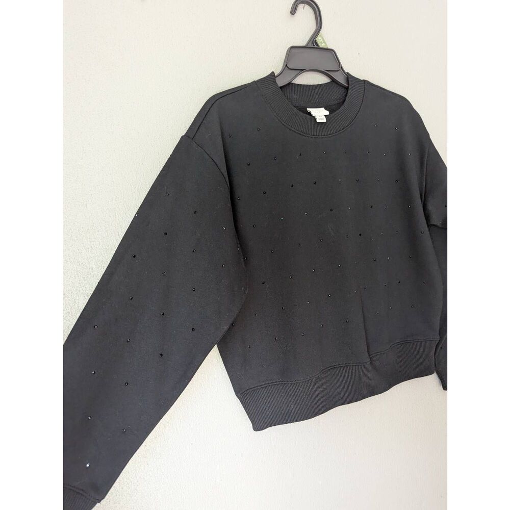 A new day black pullover sweatshirt with little black diamonds.